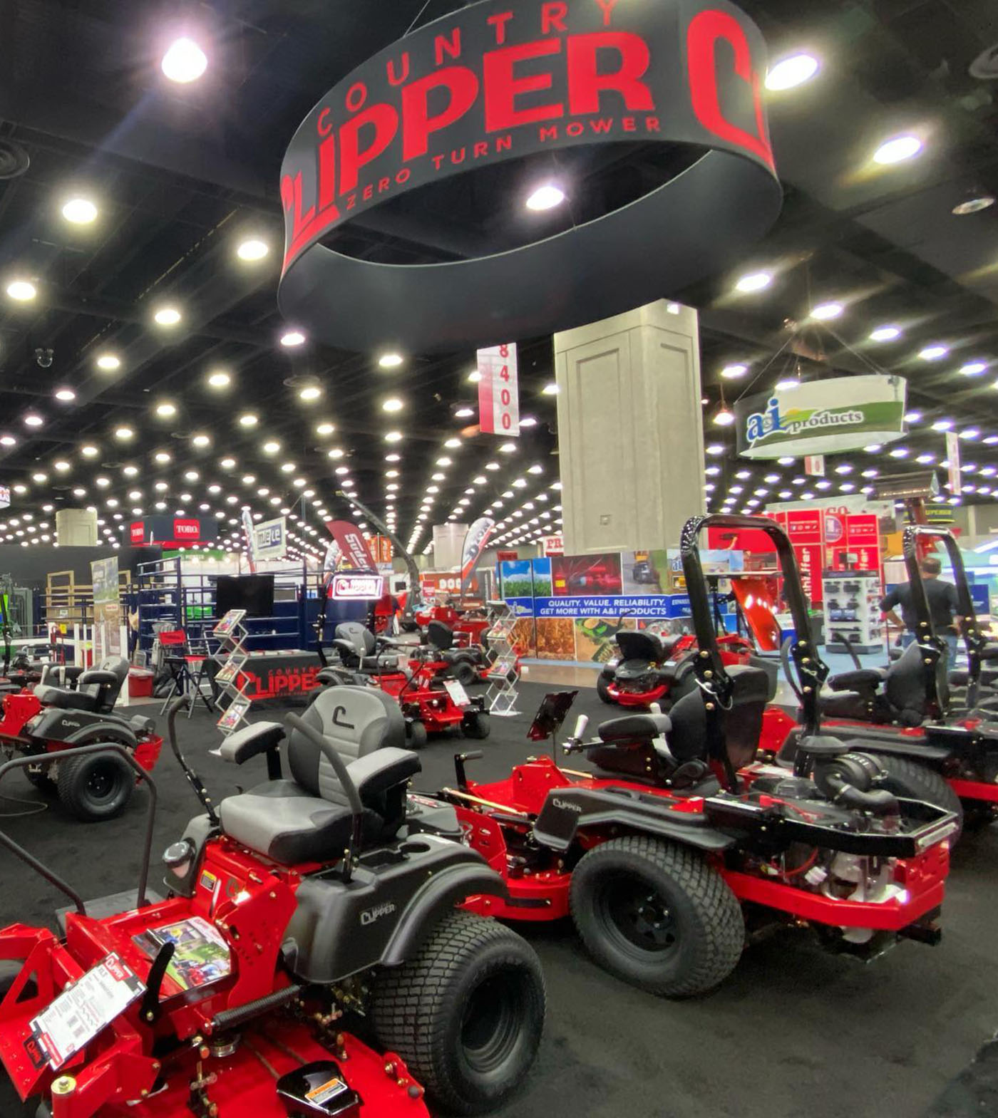 Country Clipper zero-turn mowers at a trade show.